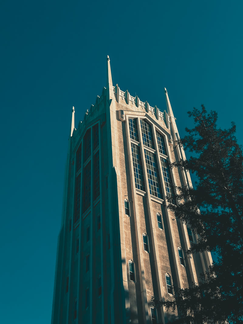 Gothic tower against a teal sky